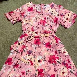 Beautiful wrap dress. Mid-thigh length, short sleeves with layered detail.